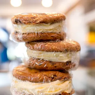 a stack of sandwiches wrapped in plastic