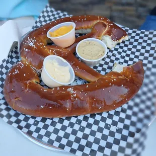 a pretzel with eggs and mustard
