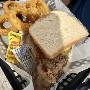 The WHITING FISH SANDWICH is well seasoned and delicious. The onion rings are also really good.