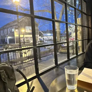 a man sitting at a table with a glass of water