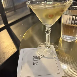 a glass of martini on a table