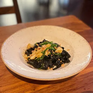 Fettuccine Nero with squid ink pasta, calabrian chili, blue crab and other stuff. Portion was small