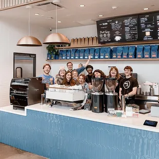 a group of people behind the counter