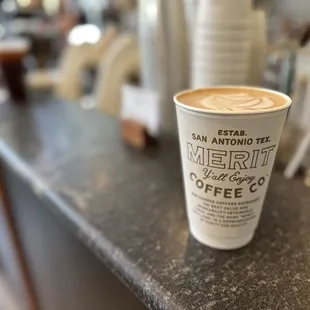 a cup of coffee on a counter