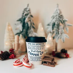 a cup of coffee and candy canes