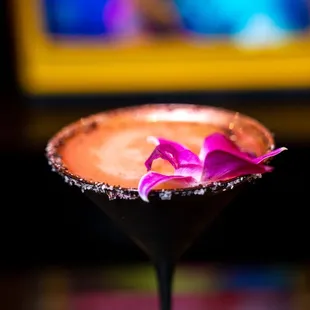  a chocolate martini with a flower on the rim