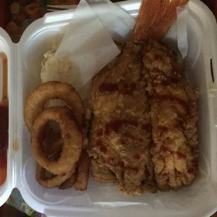 Red snapper with onion rings and potato salad. Yum