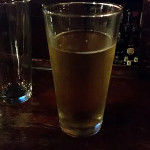 a glass of beer on a table