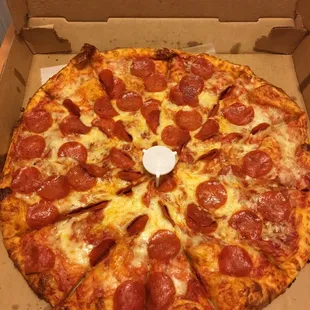 a pepperoni pizza in a box