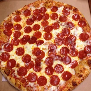 a pepperoni pizza in a box