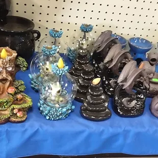 We carry a variety of backflow incense burners. The baby dragon globe is lighted..