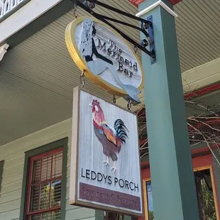 a clock on the front of a restaurant