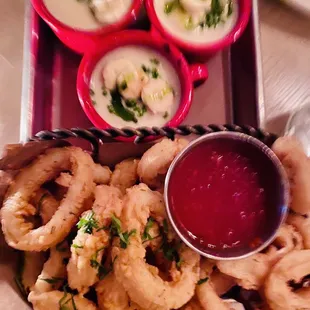 a platter of seafood and dips