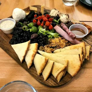 a platter of food on a wooden table