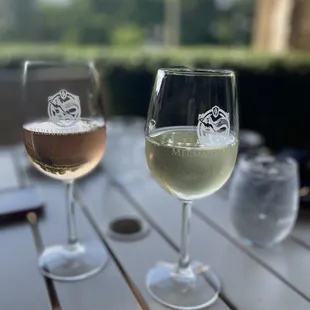two glasses of wine on a table