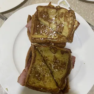 Monte Cristo... easy on the powdered sugar, thick ham and Swiss inside.... My favorite!