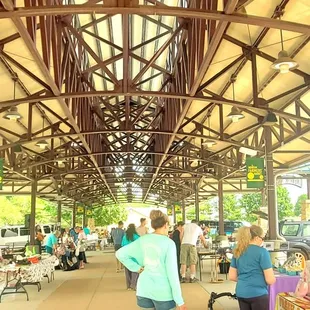 people walking through a market
