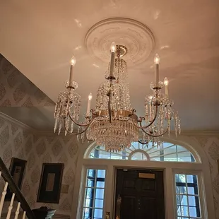 a chandelier in the foyer