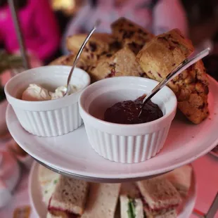 a plate of sandwiches and dipping sauce