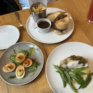 Garden Deviled eggs ($9), Roast Beef dip ($20), Pan Seared Rockfish with snap peas and potato purée ($27).