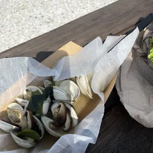 clams in tasteless water (but described as a mushroom miso broth)