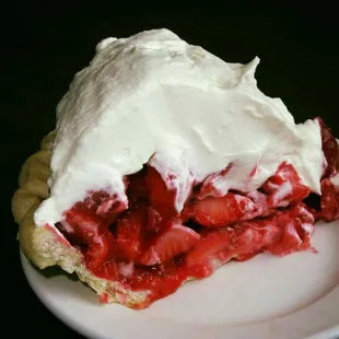 ows a strawberry pie with whipped cream