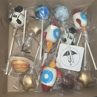 Hand painted planets and custom space cadet and rockets for a birthday celebration