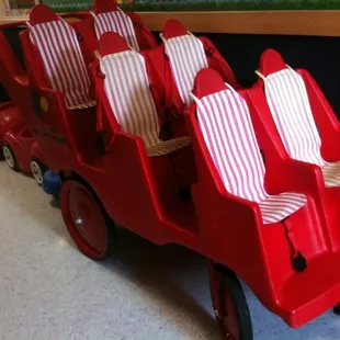 Infant Buggy for afternoon rides in sunny weather. Note the individual safety restraints