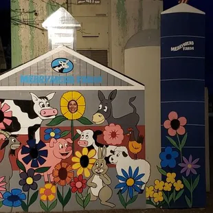 a barn with animals painted on it