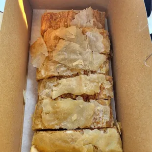 a cardboard box filled with pastry