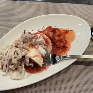 Pan a cotta with rhubarb straws and strawberry dust.