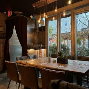 a dining room with a table and chairs
