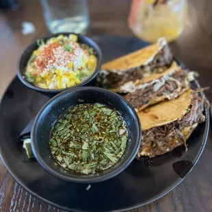 Birria Quesatacos with a side of Corn Esquite. Mango Chamoyada Margarita in the background.