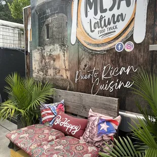a bench with pillows on it
