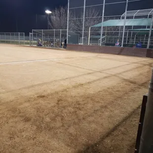 a baseball field at night