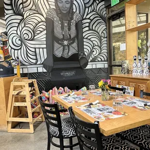 a dining room with a table and chairs