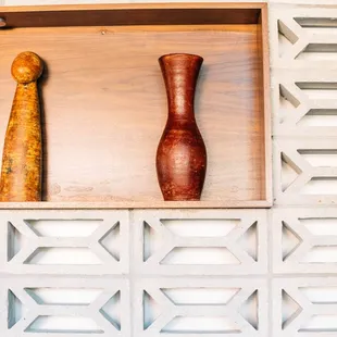 two vases on a shelf