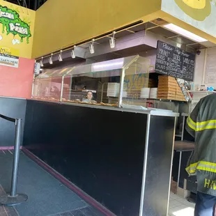 a fireman standing in front of a counter