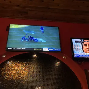 tvs showing a football game