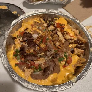 Beef and chicken fajita nachos