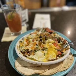 I broke it up before the pic but this Mesa Skillet with over easy eggs + green chilies and corn tortilla was fantastic