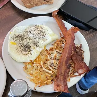bacon, eggs, hash browns and toast