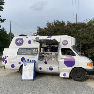 a food truck parked on the side of the road