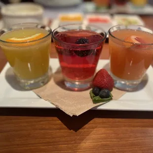 Mimosa flight. Juices: orange, cranberry and grapefruit