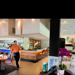 a man walking through a restaurant