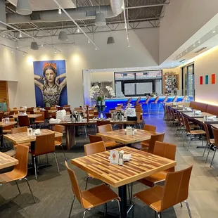 a restaurant with tables and chairs