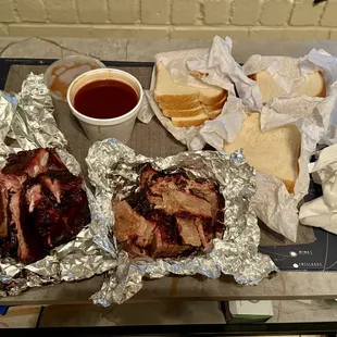 Ribs, brisket, sauce, and toast
