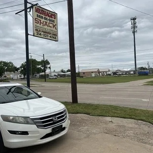 a white car parked in a parking lot