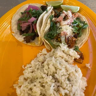 Lunch special. 1 grilled chicken and 1 grilled steak taco. Cilantro lime rice and not shown was a cup of chicken tortilla soup.