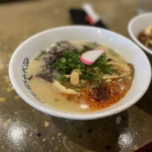 two bowls of soup on a table
